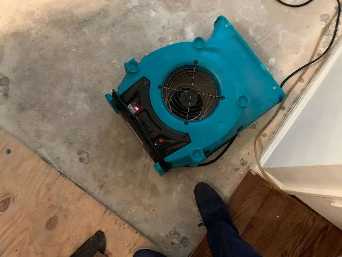 Air mover drying subfloor during Leak Detection & Repair in West Covina
